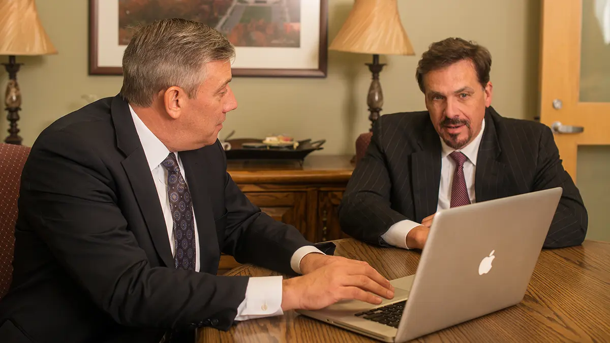 Attorney meeting with personal injury client at Dougherty and Holloway office in Liberty, Missouri